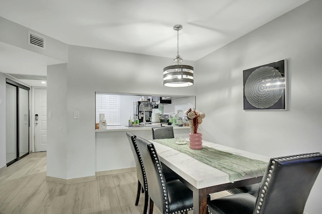 dining room with light hardwood / wood-style floors