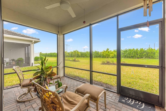 sunroom / solarium with ceiling fan