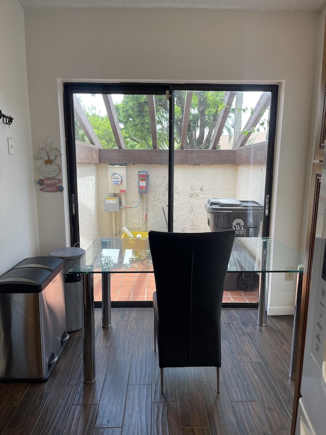 dining area with dark wood-type flooring