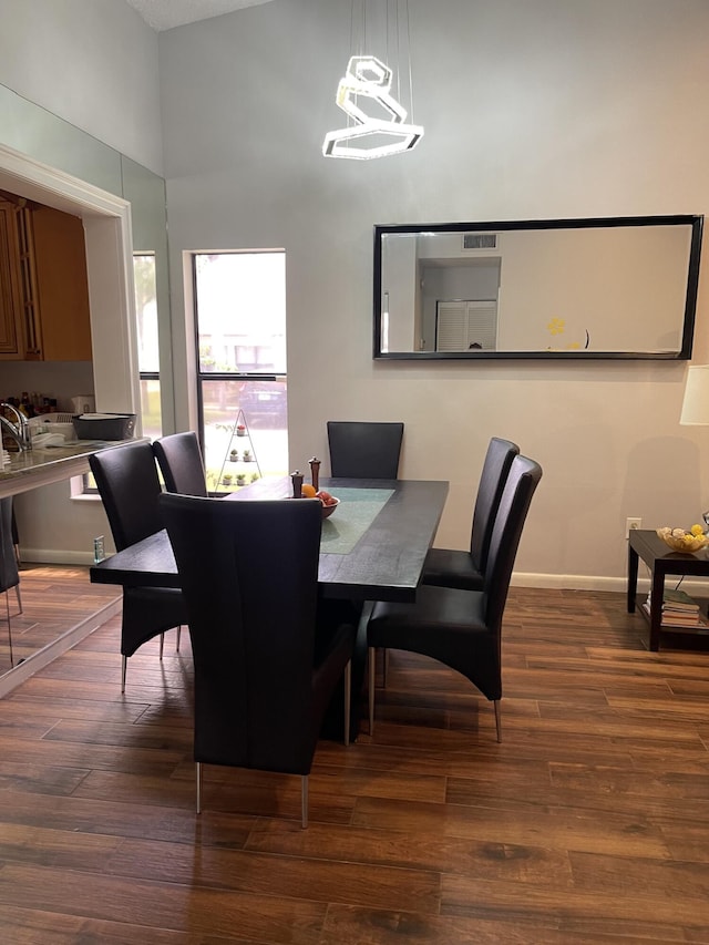 dining area with dark wood-type flooring