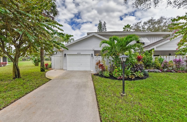 view of front of house featuring a garage and a front yard