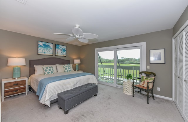 carpeted bedroom with ceiling fan, a closet, and access to outside