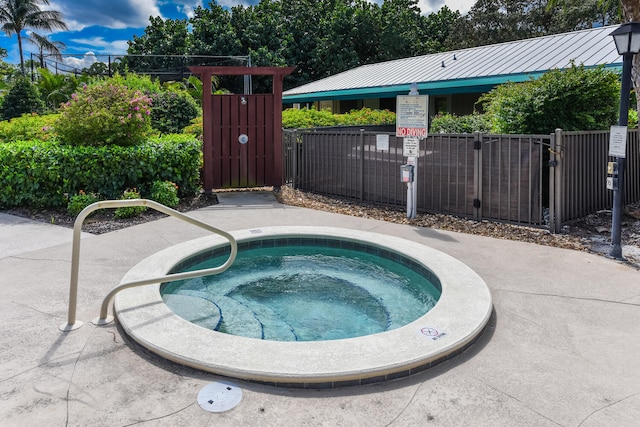 view of pool featuring a hot tub