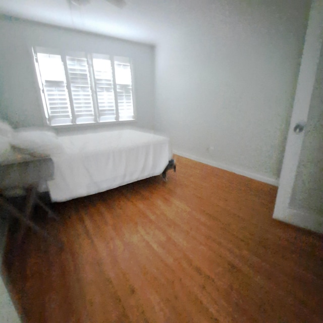 bedroom featuring dark wood-type flooring