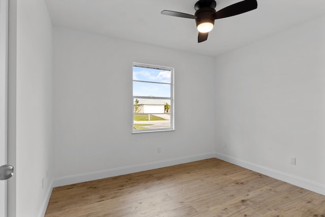 empty room featuring ceiling fan and light hardwood / wood-style flooring