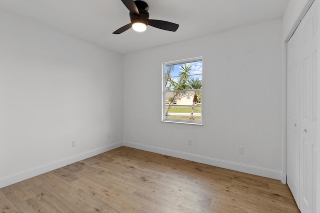 spare room featuring ceiling fan and light hardwood / wood-style floors