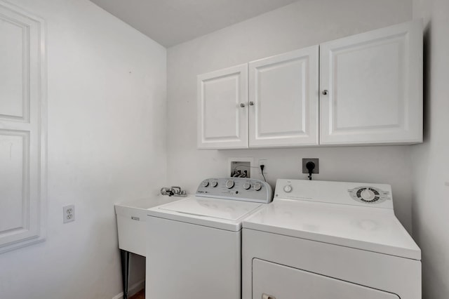 laundry area with cabinets and washer and dryer