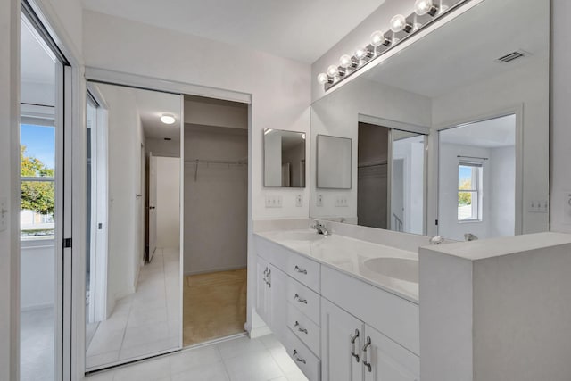 bathroom with vanity and tile patterned flooring