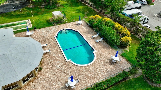 community pool featuring a patio area