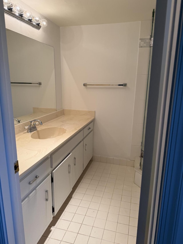 full bathroom with vanity and tile patterned floors