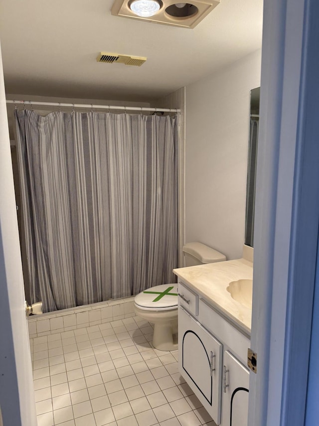 full bathroom featuring visible vents, a shower with shower curtain, toilet, tile patterned flooring, and vanity