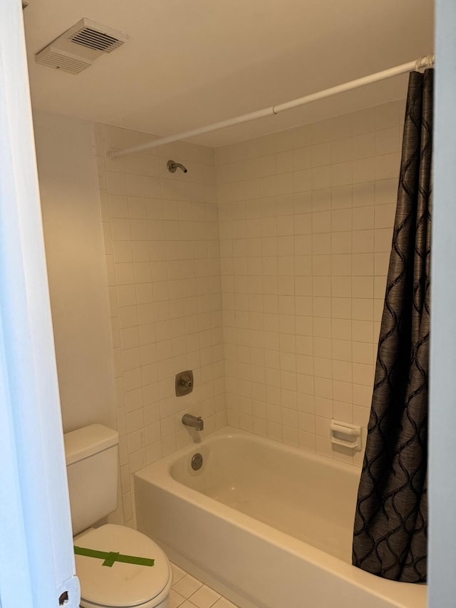 bathroom featuring tile patterned flooring, visible vents, toilet, and shower / bath combo with shower curtain