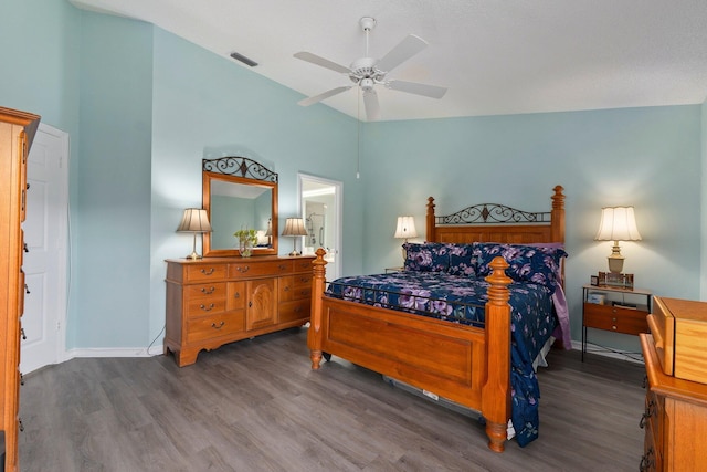 bedroom featuring lofted ceiling, dark wood-type flooring, and ceiling fan