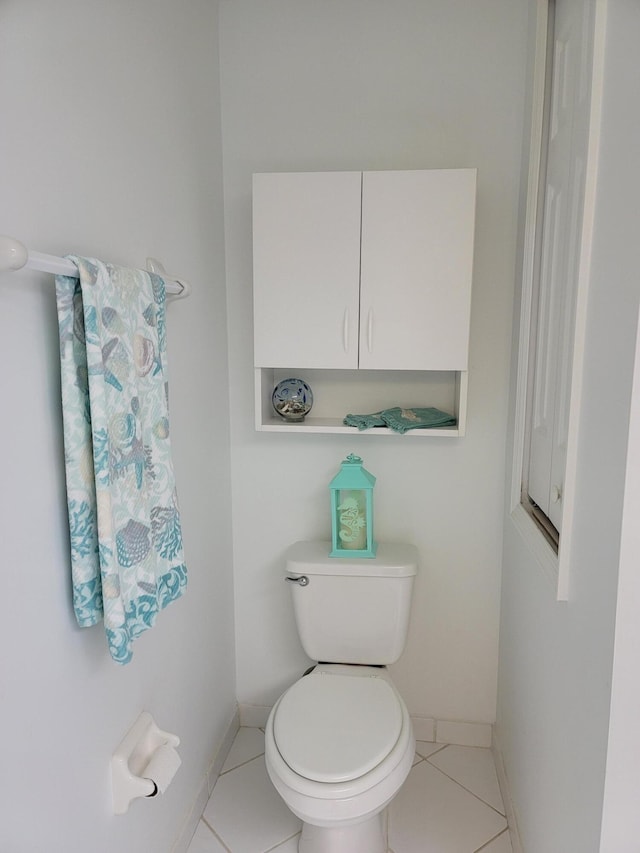 bathroom featuring tile patterned floors and toilet