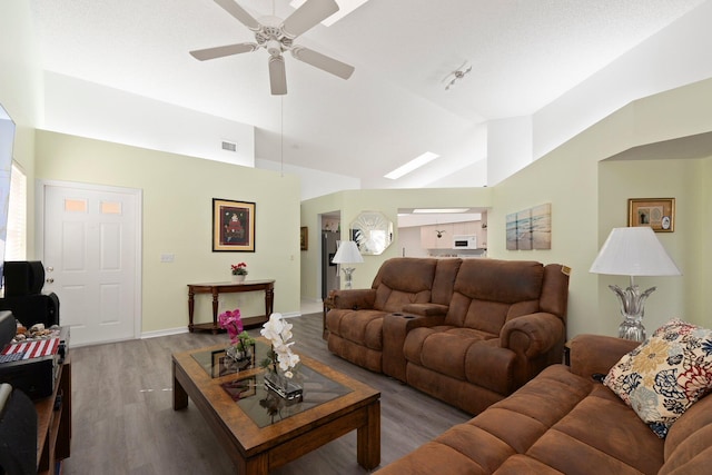 living room featuring wood-type flooring, high vaulted ceiling, and ceiling fan