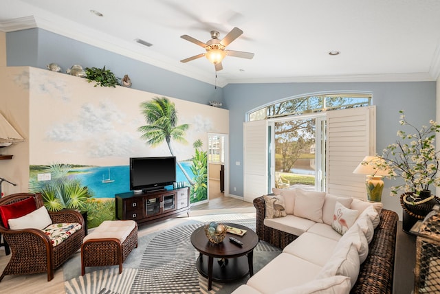 living room with ceiling fan, ornamental molding, and light wood-type flooring