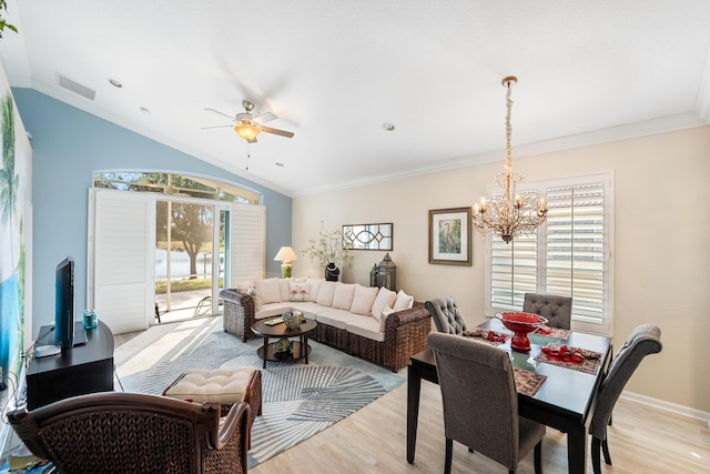 living room featuring crown molding, ceiling fan with notable chandelier, and light hardwood / wood-style floors