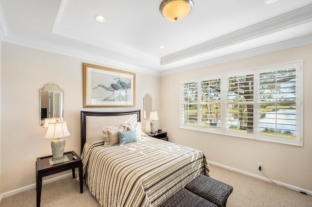 carpeted bedroom featuring a raised ceiling and ornamental molding