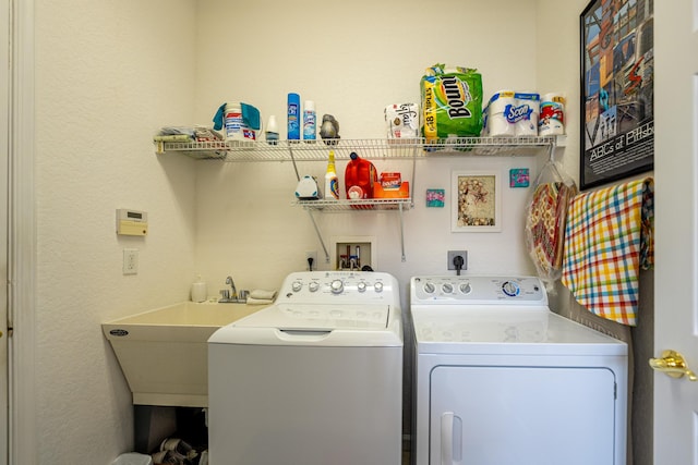 clothes washing area featuring independent washer and dryer