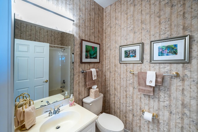 full bathroom with  shower combination, toilet, and vanity