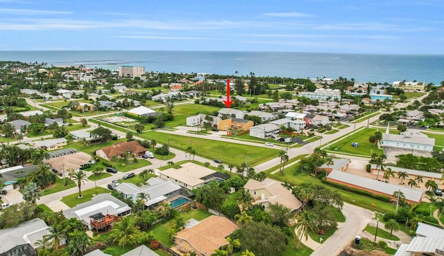 bird's eye view featuring a residential view and a water view