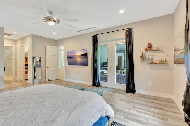 bedroom featuring french doors, ceiling fan, light wood-type flooring, and access to outside