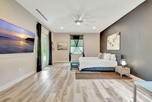 bedroom featuring light hardwood / wood-style flooring and ceiling fan