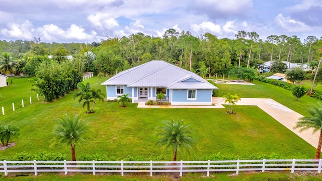 view of front of home with a rural view