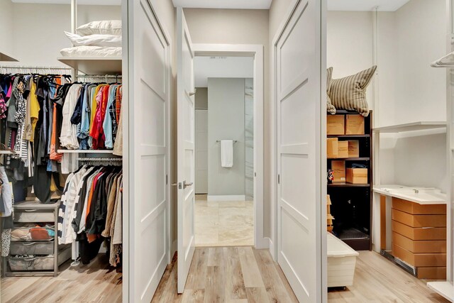 bathroom with separate shower and tub and hardwood / wood-style floors