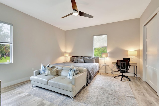 bedroom featuring light wood-type flooring and ceiling fan