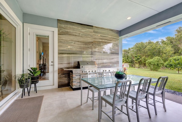 view of patio with a grill and an outdoor kitchen