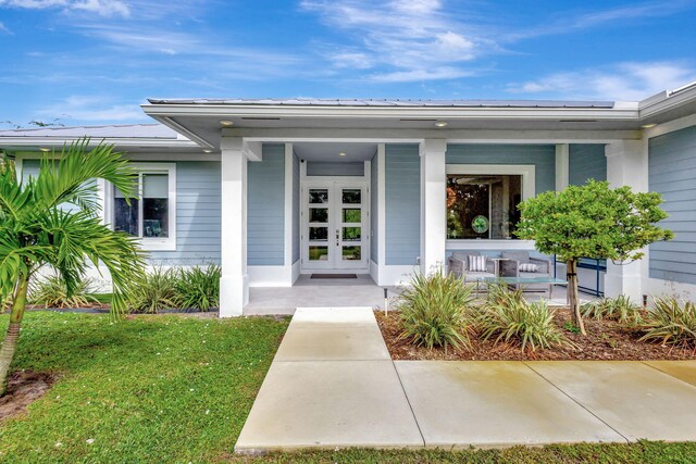 doorway to property with a patio area and french doors