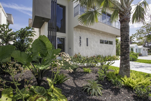 view of side of property featuring stucco siding