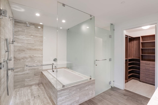 bathroom with shower with separate bathtub