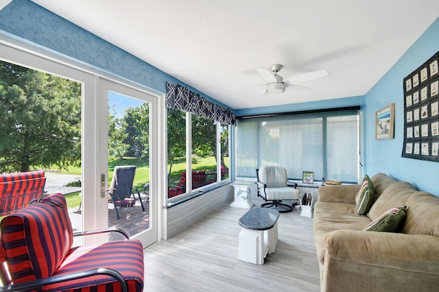 sunroom / solarium with ceiling fan