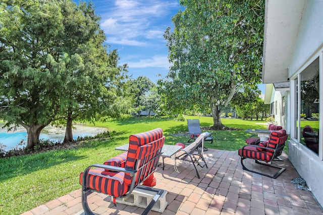 view of patio with a water view