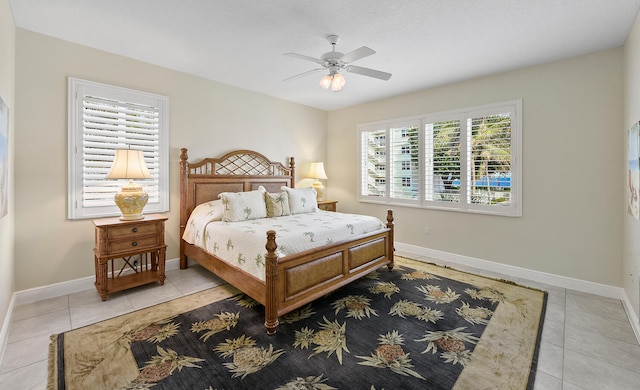 bedroom with light tile patterned floors and ceiling fan