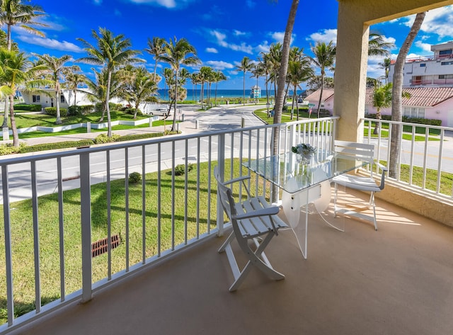 balcony featuring a water view