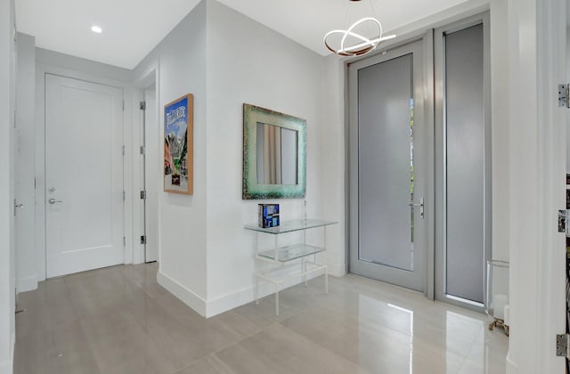 foyer entrance featuring a chandelier