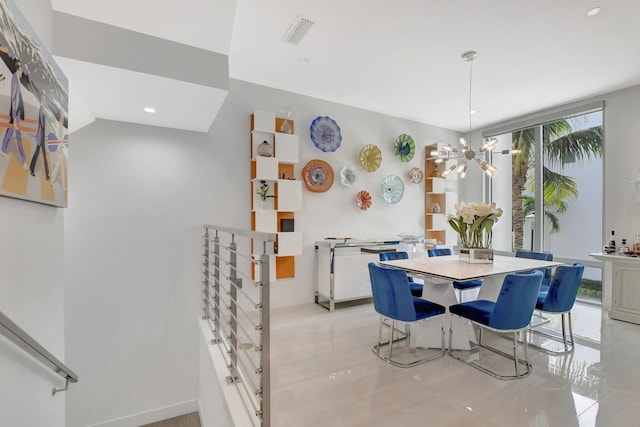 dining space with an inviting chandelier