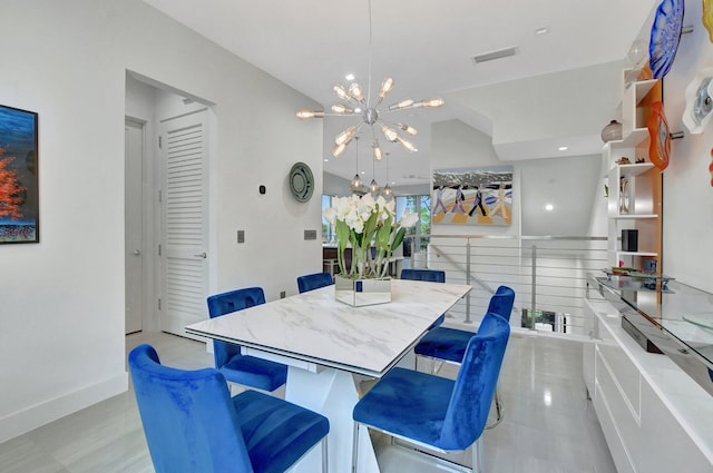 dining space featuring a notable chandelier