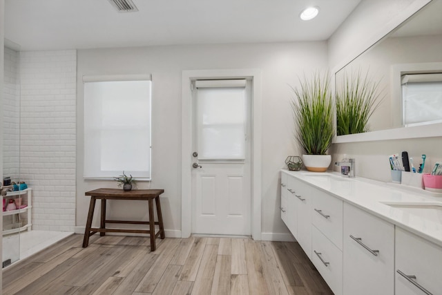 bathroom featuring vanity and hardwood / wood-style floors