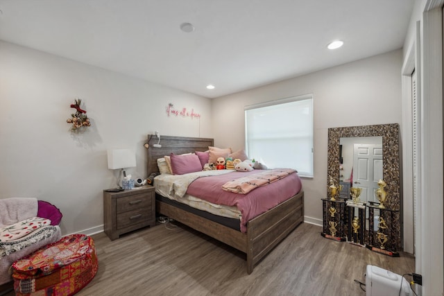 bedroom featuring hardwood / wood-style floors