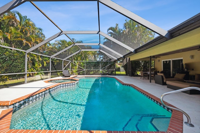 view of swimming pool with an in ground hot tub, a patio, an outdoor hangout area, and glass enclosure