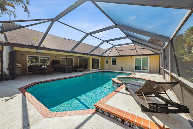 view of pool featuring a patio, glass enclosure, an outdoor living space, grilling area, and an in ground hot tub