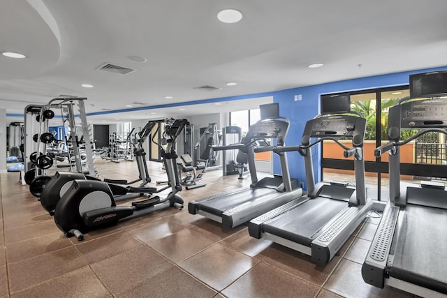 workout area featuring visible vents and recessed lighting