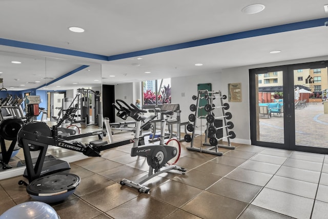 workout area featuring recessed lighting, french doors, and baseboards