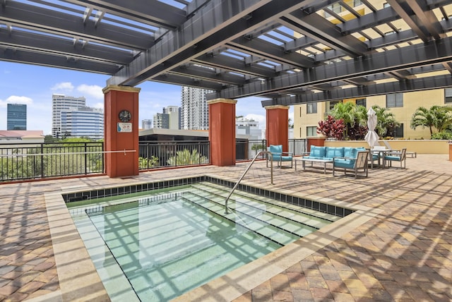 view of pool featuring outdoor lounge area and a pergola