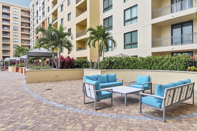 view of patio with a gazebo and outdoor lounge area