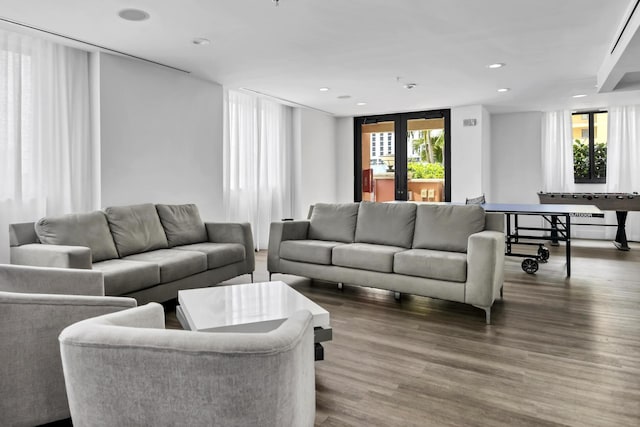 living area with french doors, dark wood-style flooring, and recessed lighting